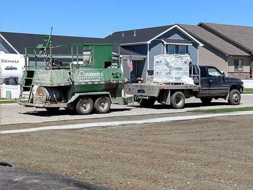 hydroseeding trailer in front of home